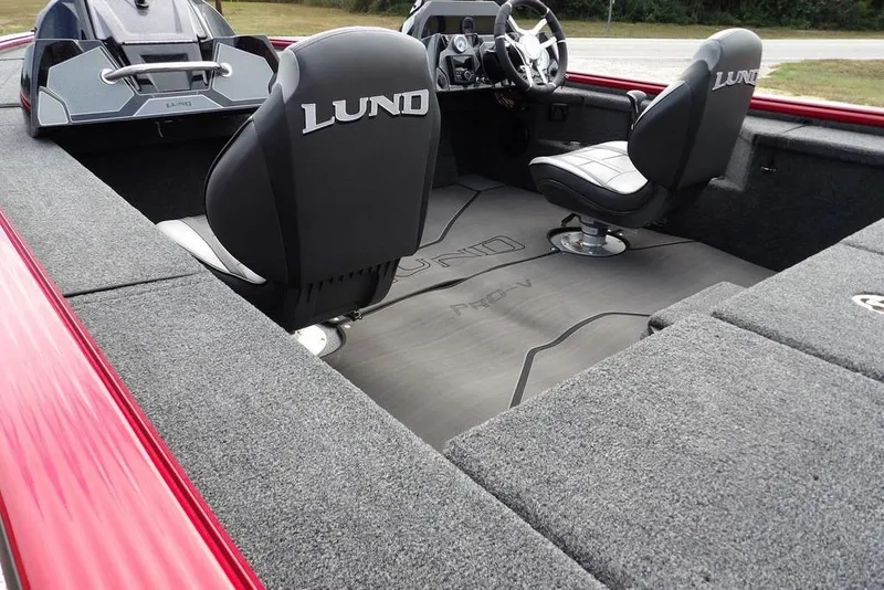 Slide: The Image of 2025 Lund 2075 Pro-V Bass XS interior with sleek seating and modern dashboard design. - 12