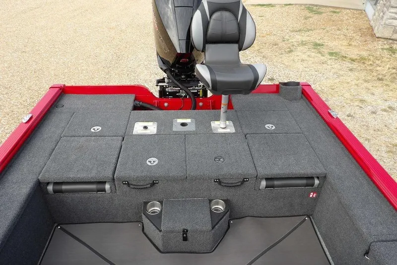 Slide: The Image of 2025 Lund 2075 Pro-V Bass XS boat interior with seating and storage compartments. - 13