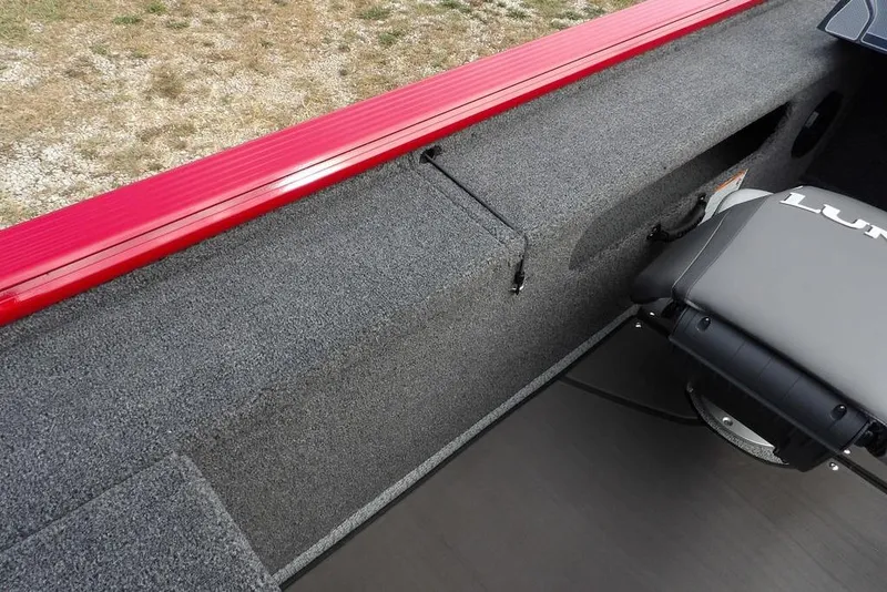 Slide: The Image of 2025 Lund 2075 Pro-V Bass XS interior with red trim and seating. - 18