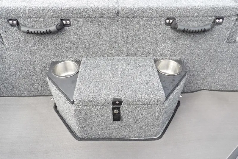 Slide: The Image of 2025 Lund 2075 Pro-V Bass XS boat interior with cup holders and storage compartment. - 20