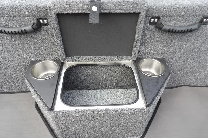Slide: The Image of 2025 Lund 2075 Pro-V Bass XS boat storage compartment with cup holders. - 22