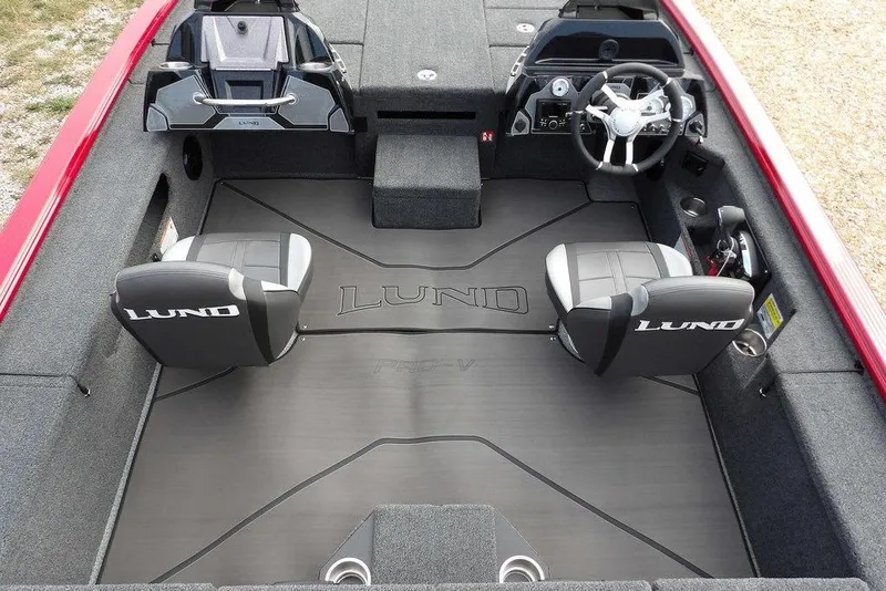 Slide: The Image of 2025 Lund 2075 Pro-V Bass XS interior with dual seats and steering console. - 27