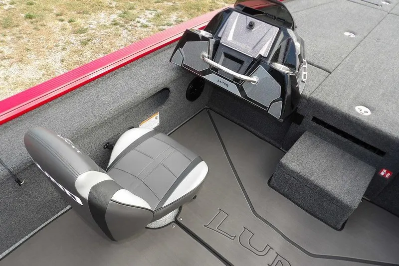 Slide: The Image of 2025 Lund 2075 Pro-V Bass XS boat interior with seating and control panel. - 30