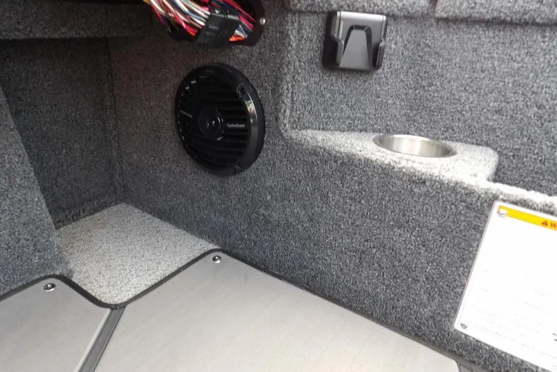 Slide: The Image of Interior of 2025 Lund 2075 Pro-V Bass XS boat with speaker and cup holder. - 32