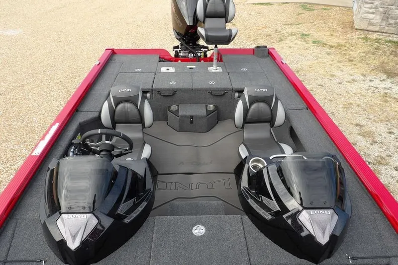 Slide: The Image of 2025 Lund 2075 Pro-V Bass XS boat interior with dual consoles and seating. - 39