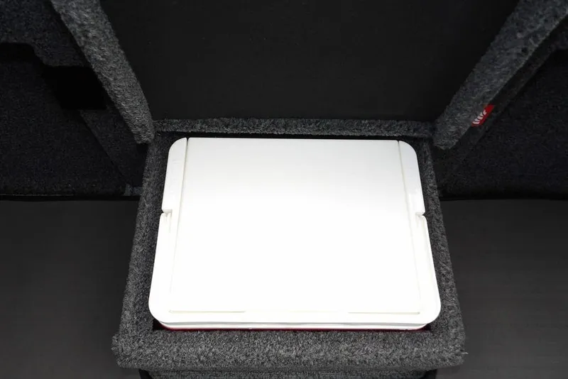 Slide: The Image of Storage compartment in 2025 Lund 2075 Pro-V Bass XS boat, featuring a white lid. - 43