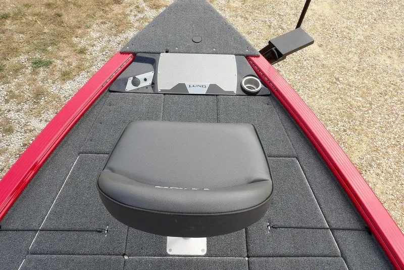 Slide: The Image of 2025 Lund 2075 Pro-V Bass XS boat deck with seat and red trim. - 48