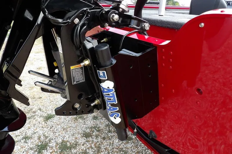 Slide: The Image of 2025 Lund 2075 Pro-V Bass XS boat with Atlas hydraulic jack plate, red exterior. - 59