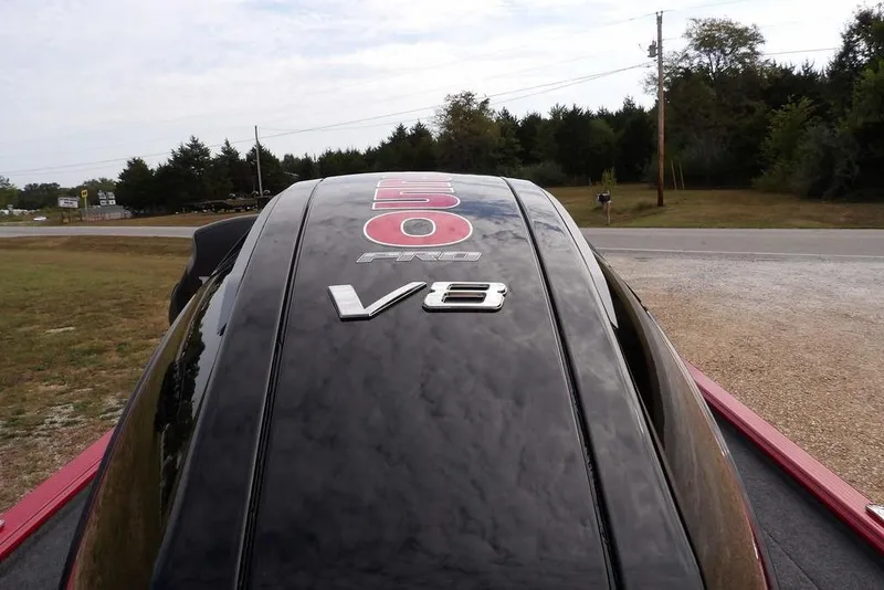 Slide: The Image of 2025 Lund 2075 Pro-V Bass XS with V8 engine, parked outdoors. - 64