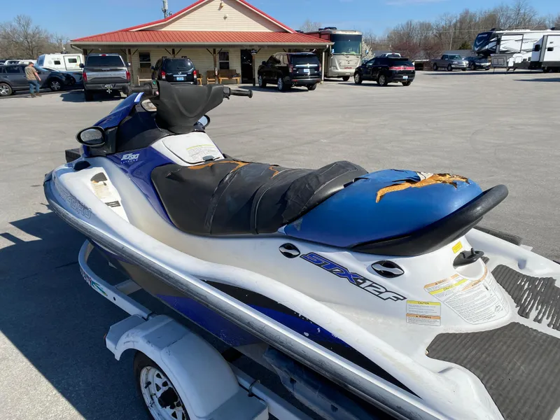 Slide: The Image of 2007 Kawasaki STX-12F jet ski on trailer in parking lot. - 11