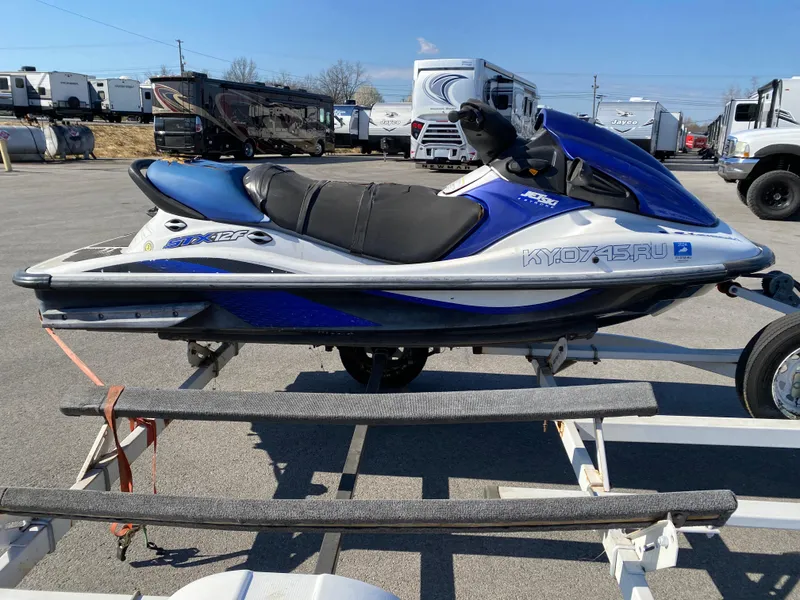 Slide: The Image of 2007 Kawasaki STX-12F jet ski in blue and white on a trailer. - 23