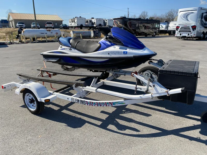 Slide: The Image of 2007 Kawasaki STX-12F jet ski on trailer in parking lot. - 24
