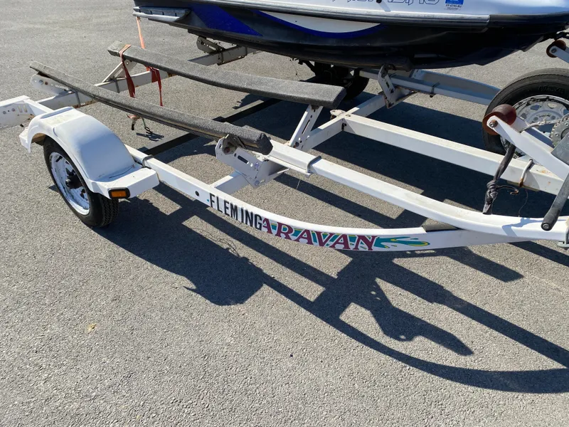 Slide: The Image of Trailer for 2007 Kawasaki STX-12F jet ski on pavement. - 26