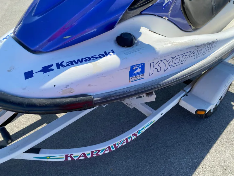 Slide: The Image of 2007 Kawasaki STX-12F jet ski on Karavan trailer, blue and white design. - 9