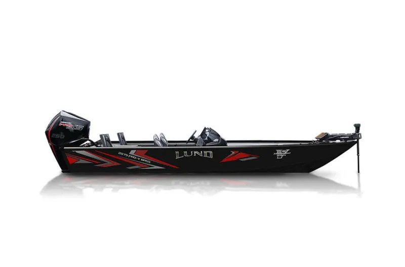Slide: The Image of 2025 Lund 2075 Pro-V Bass XS boat on trailer, parked outside marine center. - 1
