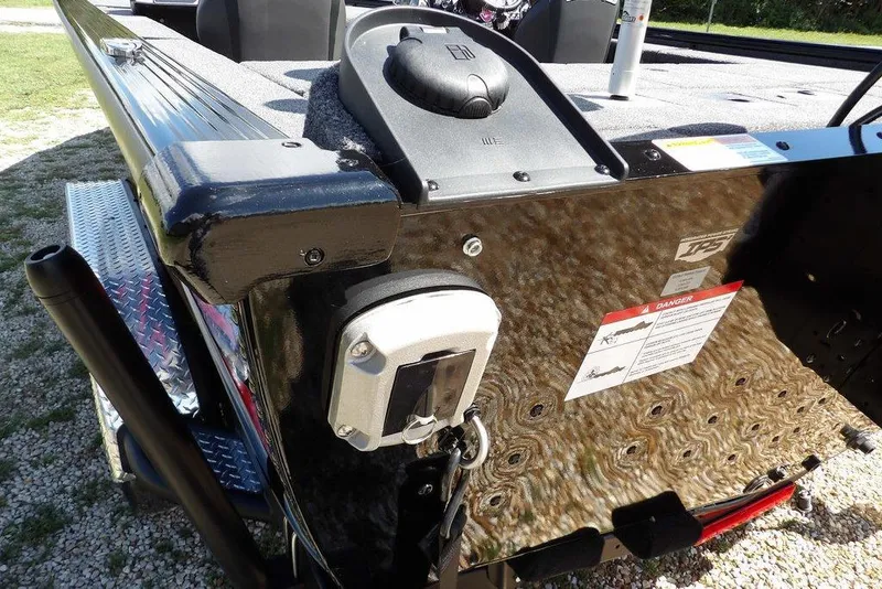 Slide: The Image of 2025 Lund 2075 Pro-V Bass XS boat interior with seating and storage compartments. - 11