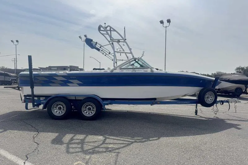 Slide: The Image of Open storage compartment in 2025 Lund 2075 Pro-V Bass XS boat, showing wiring and battery setup. - 13