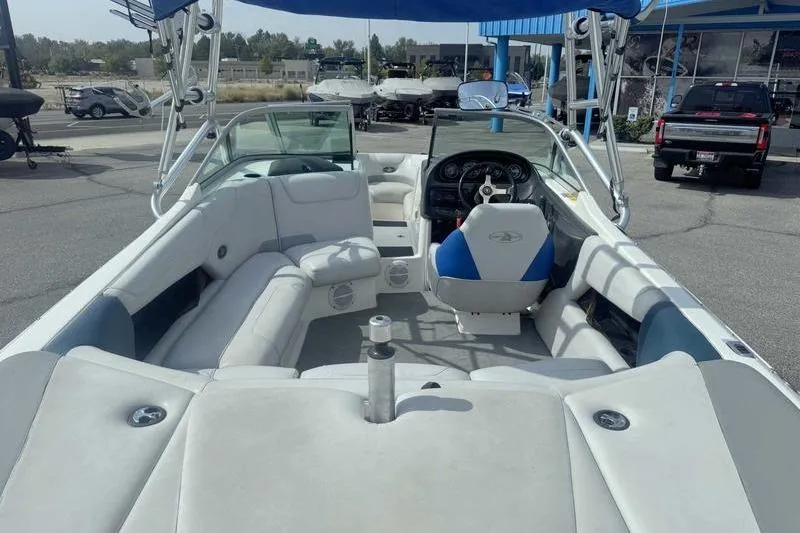 Slide: The Image of 2025 Lund 2075 Pro-V Bass XS interior with carpeted storage and seating. - 20