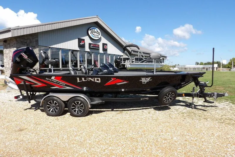 Slide: The Image of Dashboard of 2025 Lund 2075 Pro-V Bass XS boat with control panel and gauges. - 26