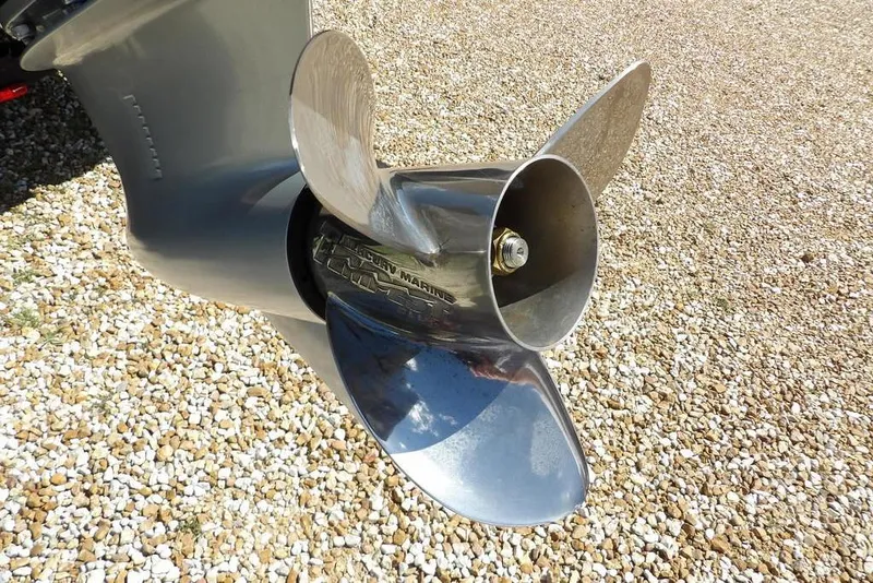 Slide: The Image of 2025 Lund 2075 Pro-V Bass XS boat with sleek design and powerful engine. - 3