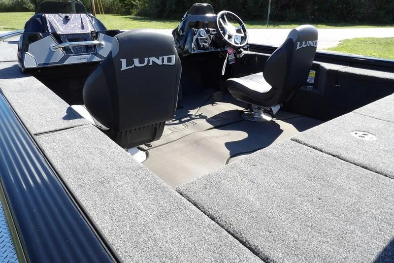 Slide: The Image of 2025 Lund 2075 Pro-V Bass XS boat deck with embossed logo and shadow. - 33