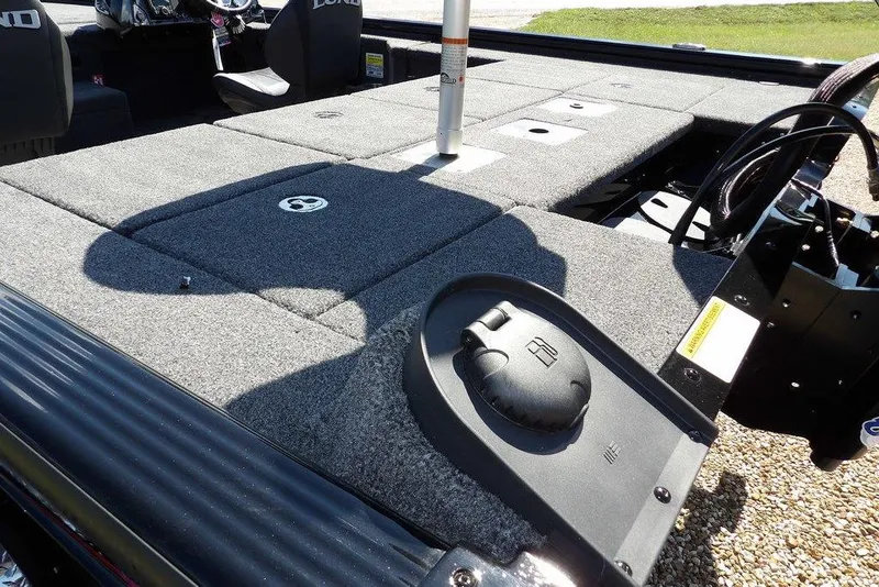 Slide: The Image of 2025 Lund 2075 Pro-V Bass XS boat interior with spacious deck and storage compartments. - 35