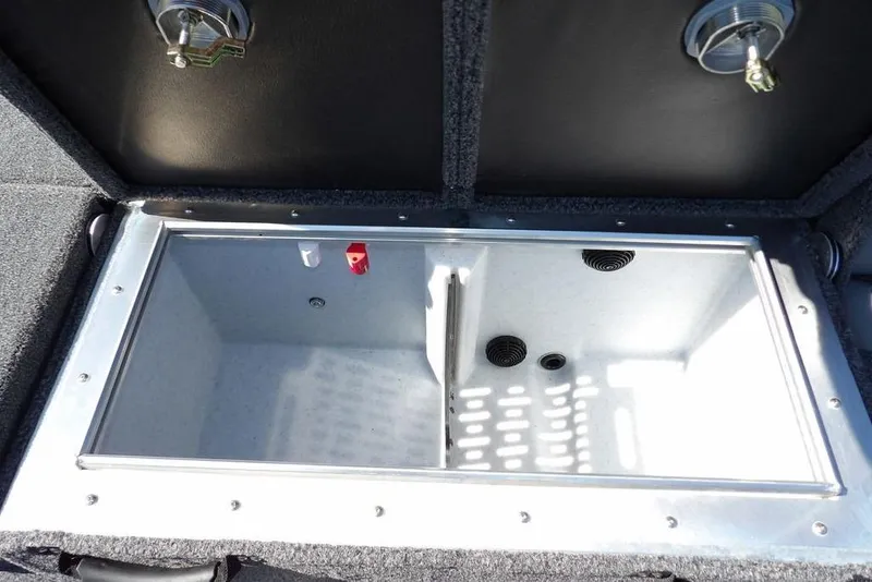 Slide: The Image of 2025 Lund 2075 Pro-V Bass XS boat cockpit with steering wheel and seating. - 39