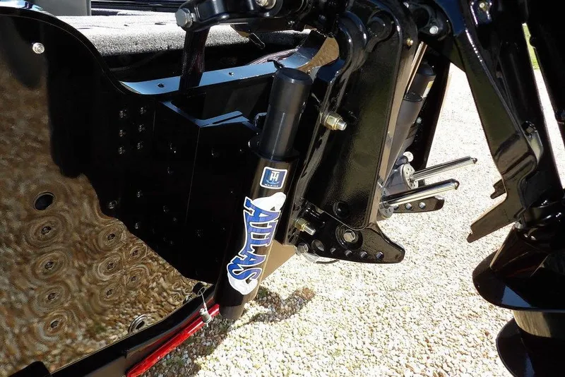 Slide: The Image of 2025 Lund 2075 Pro-V Bass XS boat on trailer, parked outdoors on a sunny day. - 4