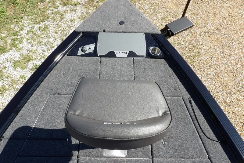 Slide: The Image of 2025 Lund 2075 Pro-V Bass XS boat deck with seat and control panel. - 45