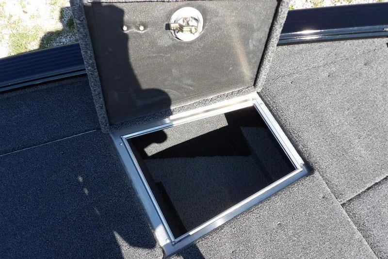Slide: The Image of Open storage compartment on 2025 Lund 2075 Pro-V Bass XS boat deck. - 46