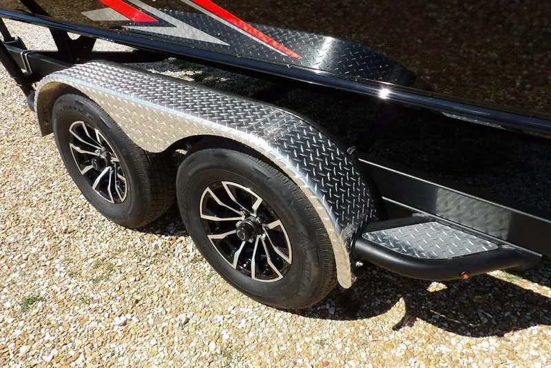 Slide: The Image of 2025 Lund 2075 Pro-V Bass XS trailer with dual wheels and diamond plate fenders. - 52