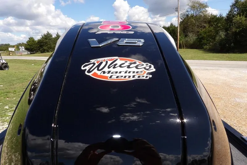 Slide: The Image of 2025 Lund 2075 Pro-V Bass XS with V8 engine, featuring "White's Marine Center" sticker. - 56