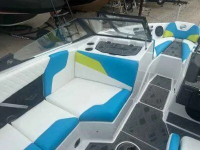 Slide: The Image of 2024 Tigé Z3 boat interior with blue and white seating, modern design. - 7