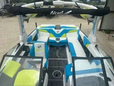 Slide: The Image of 2024 Tigé Z3 boat interior with vibrant blue and yellow seating. - 9