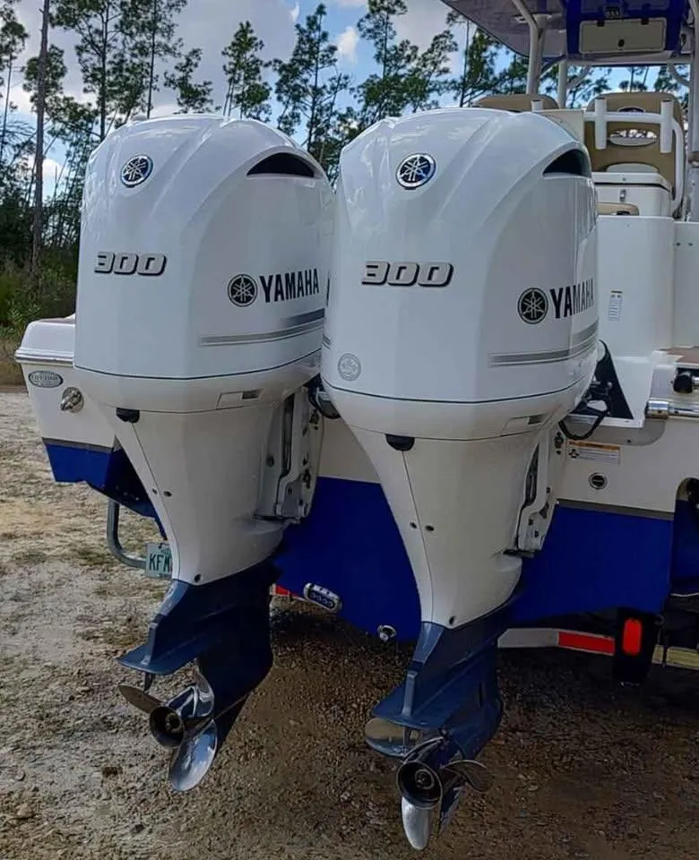 Slide: The Image of 2019 NauticStar 28 XS Offshore with twin Yamaha 300 outboard engines. - 16