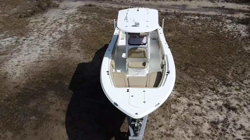 Slide: The Image of 2019 NauticStar 28 XS Offshore boat on dry land, aerial view. - 2