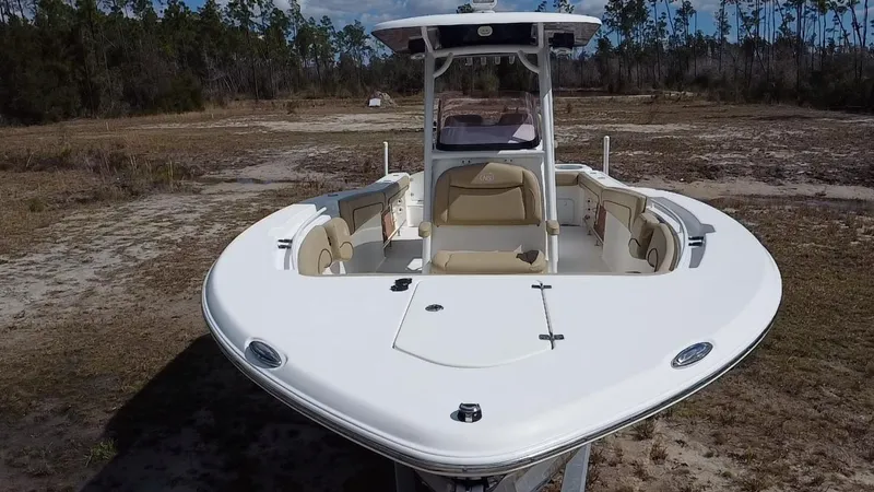 Slide: The Image of 2019 NauticStar 28 XS Offshore boat with seating, parked on dry land. - 20