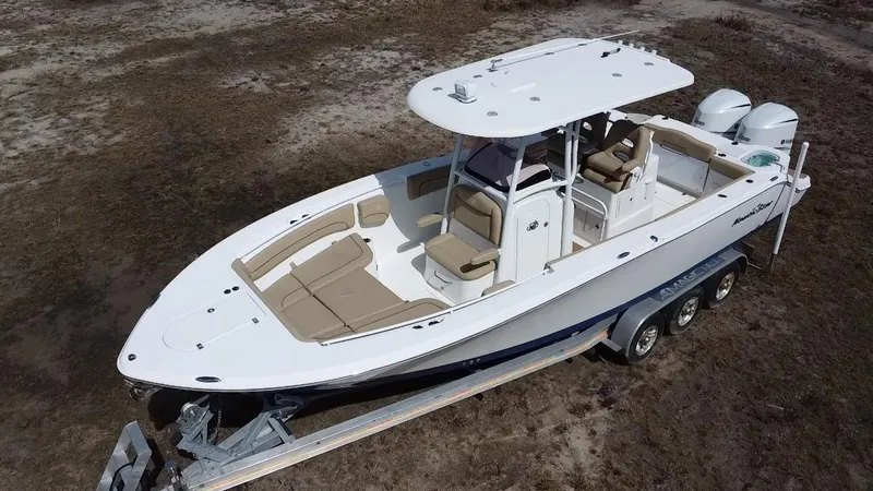 Slide: The Image of 2019 NauticStar 28 XS Offshore boat on trailer, aerial view. - 3