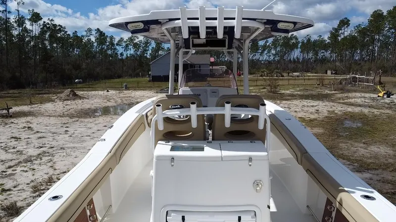 Slide: The Image of 2019 NauticStar 28 XS Offshore boat with dual seating, set in a scenic outdoor location. - 33