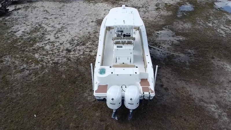 Slide: The Image of 2019 NauticStar 28 XS Offshore boat with dual engines, aerial view. - 6