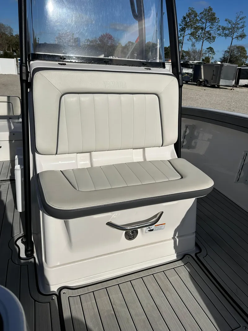 Slide: The Image of 2021 Yamaha Boats 210 FSH Sport interior seating with sleek design and durable materials. - 14