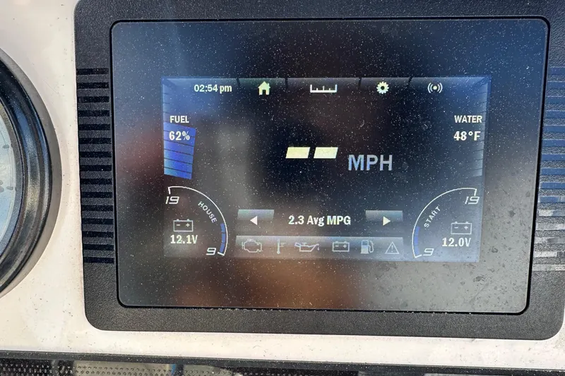 Slide: The Image of Dashboard display of a 2021 Yamaha Boats 210 FSH Sport showing fuel, speed, and water temperature. - 31