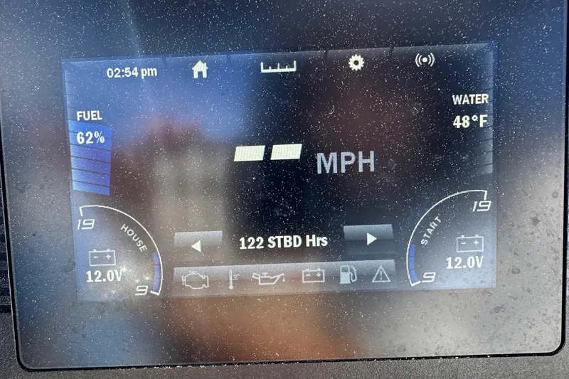 Slide: The Image of Dashboard display of a 2021 Yamaha Boats 210 FSH Sport, showing speed, fuel, and water temperature. - 33