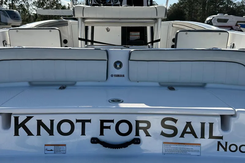 Slide: The Image of 2021 Yamaha Boats 210 FSH Sport with "Knot for Sail" lettering on the stern. - 9