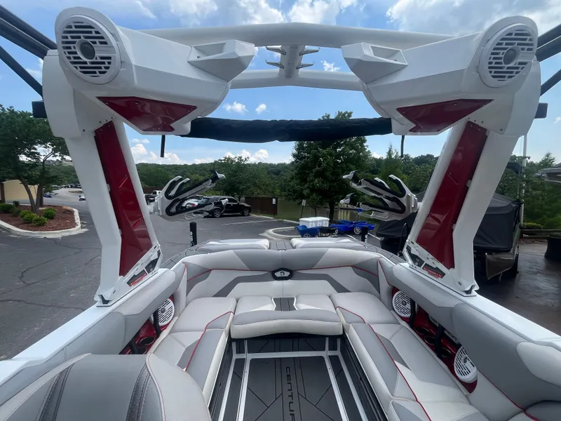 Slide: The Image of 2022 Centurion Ri230 boat interior with premium seating and advanced audio system. - 16