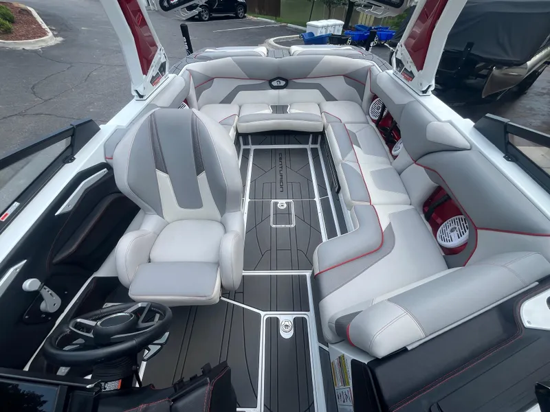 Slide: The Image of 2022 Centurion Ri230 boat interior with sleek seating and modern design. - 19