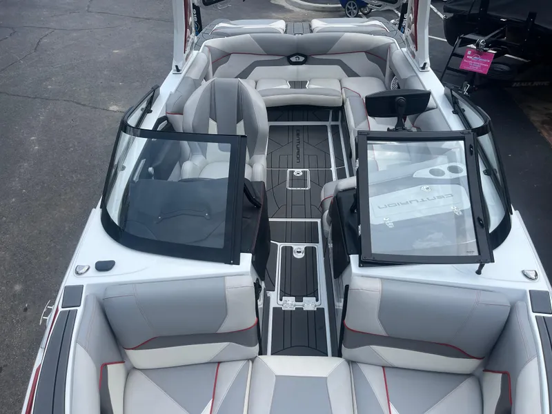 Slide: The Image of 2022 Centurion Ri230 boat interior with gray seating and open windshield. - 21