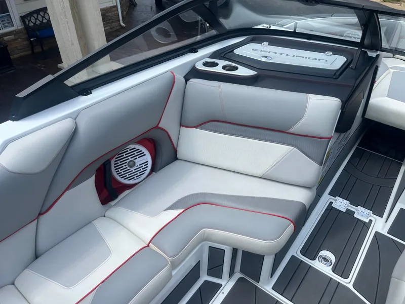 Slide: The Image of 2022 Centurion Ri230 boat interior with sleek seating and modern design. - 24