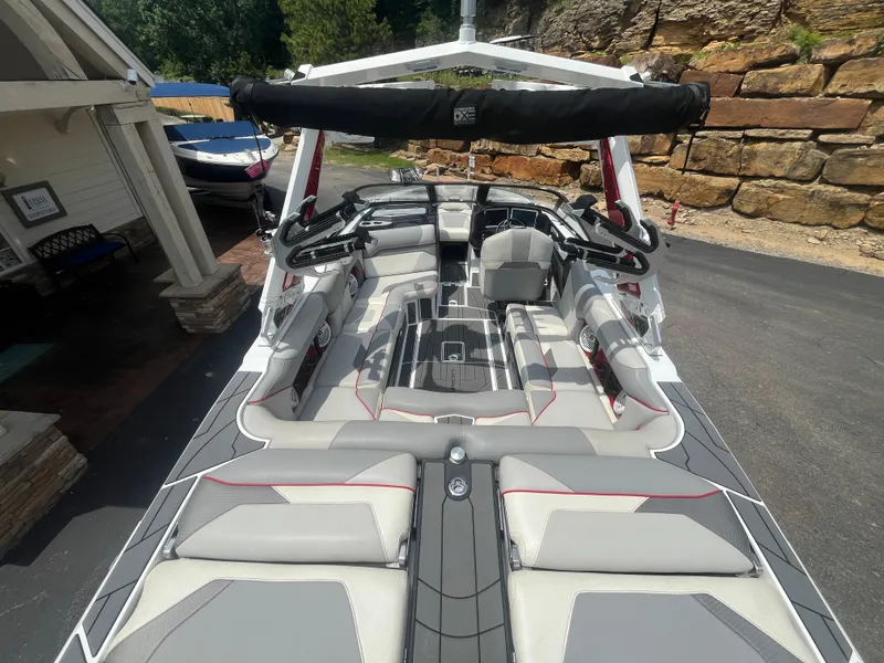 Slide: The Image of 2022 Centurion Ri230 boat interior with sleek seating and modern design. - 26