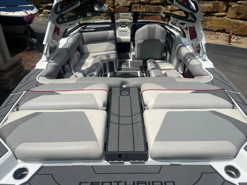 Slide: The Image of 2022 Centurion Ri230 boat interior with luxurious seating and modern design. - 28